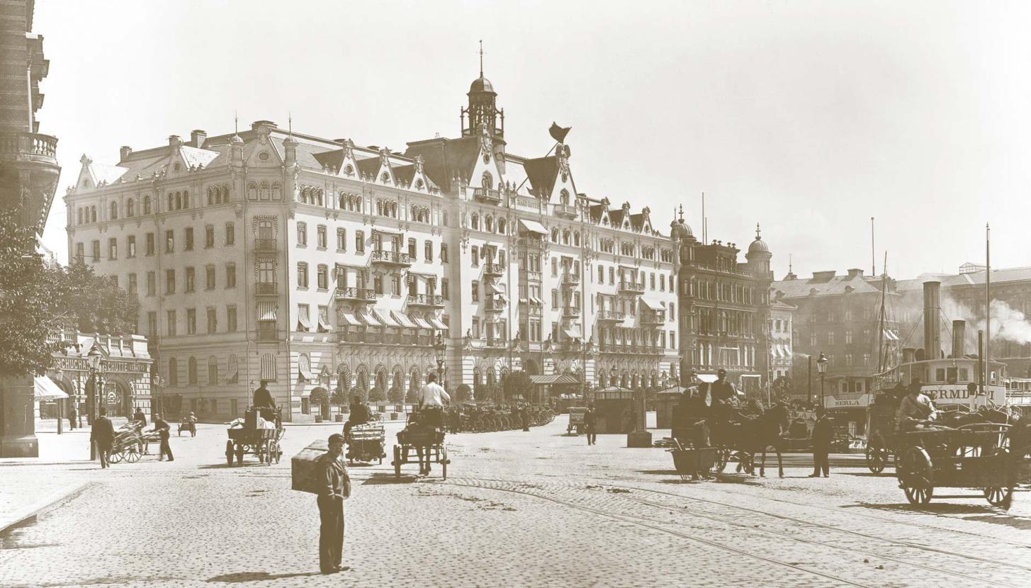 Old facade with people on the streets